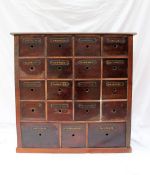 A 19th century mahogany and pine pharmacy cabinet, with nineteen drawers,