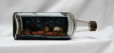 A scene in a bottle, depicting a village, boat and lighthouse, bears a label "P.O.W.