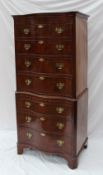 A reproduction mahogany chest on chest, the serpentine moulded top above four graduated drawers,