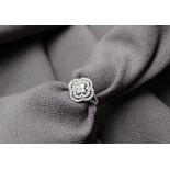 A open work diamond dress ring set with brilliant cut diamonds to a 9ct yellow gold setting and