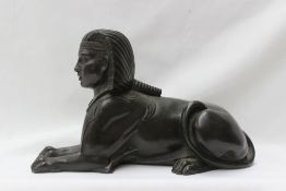 A bronze model of a sphinx, unsigned,