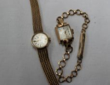 A lady's 9ct yellow gold wristwatch, the circular dial inscribed Garrard, on a 9ct gold strap,