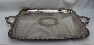 A Walker & Hall electroplated twin handled tray, with a gadrooned edge and floral corners,