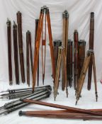 Eighteen various tripods metal and treen with varying screw fittings