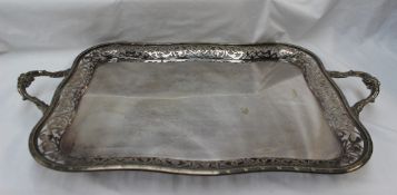 An electroplated twin handled tray, with a pierced edge and leaf cast handles,