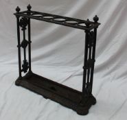 A Victorian cast iron stick stand, with six compartments and a drip tray moulded with leaves,