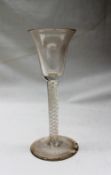 An 18th century wine glass, with flared tapering bowl,