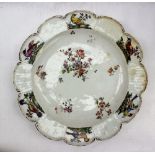 An 18th century Chelsea porcelain plate, of scalloped circular form,