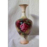 A Royal Worcester porcelain baluster vase decorated with roses to an ivory ground on a spreading