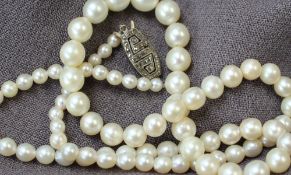 A pearl necklace, with circa 83 graduating pearls, from 8mm to 4mm,