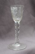 An 18th century wine glass with a flared bowl,