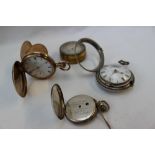 A George III silver pair cased open faced pocket watch, the circular dial with Roman numerals,