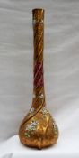 A Victorian ruby and gilt glass large single stem vase with raised scrolls and applied flowers,