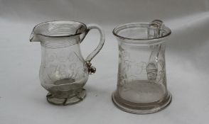 A late 18th / early 19th century glass beer mug engraved with leaves and initialled FB, 11cm high,