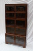 A 20th century mahogany sectional bookcase with five glazed sections with hinged doors,
