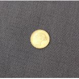 A Victorian gold half sovereign dated 1883