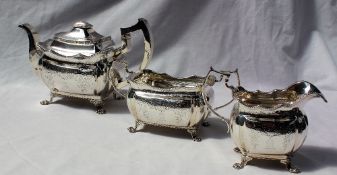 A George IV silver three piece tea set, comprising a rectangular teapot, cream jug and sugar basin,