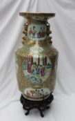A Chinese Famille Rose baluster vase, with gilt dog of foo handles,