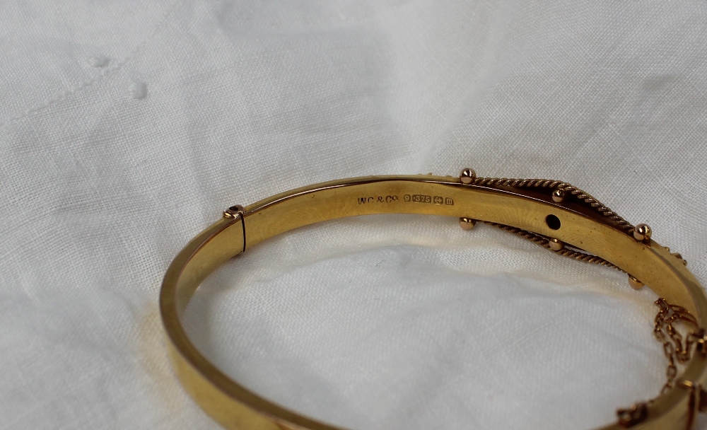 A 9ct gold bangle, with a single inset diamond together with a 9ct gold cross, - Image 2 of 3