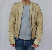 Roberto Cavalli - A Gentleman's cream leather bomber type jacket, size small,