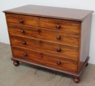 A Victorian walnut chest, the rectangular top above two short and three long drawers on turned feet,