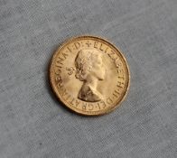 An Elizabeth II gold sovereign dated 1957