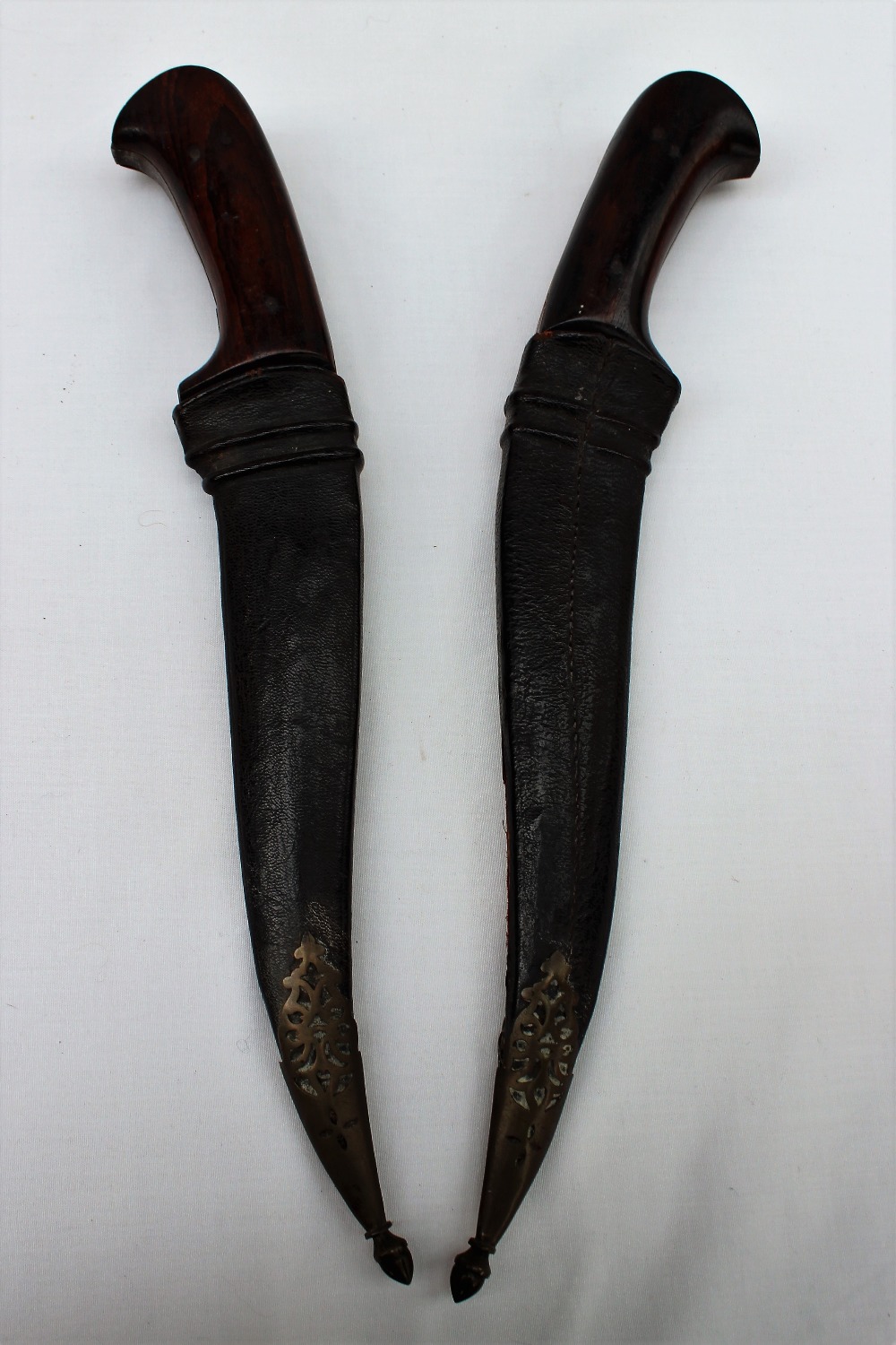 A pair of daggers with rosewood grips,
