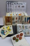 A stamp stock book together with Players cigarette cards, Will's cigarette cards,