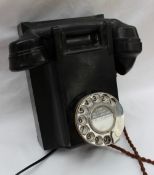 A black bakelite telephone, The handset marked "TR", the base stamped No.