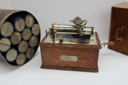 The Edison bell consolidated phonograph Co "The Empire" phonograph in an oak case together with a