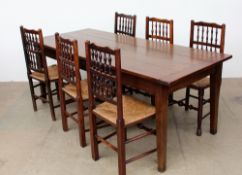 An 18th century style oak refectory table with a planked top on square tapering legs,