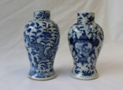 A Chinese porcelain baluster vase decorated with figures holding a vase,