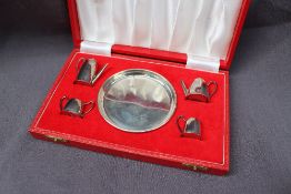 An Elizabeth II silver miniature tea service comprising a hot water pot, teapot,