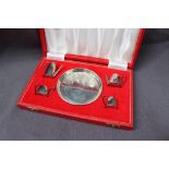 An Elizabeth II silver miniature tea service comprising a hot water pot, teapot,