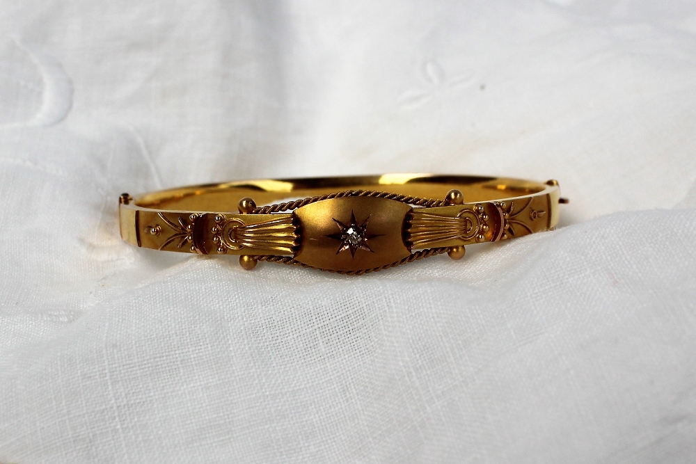 A 9ct gold bangle, with a single inset diamond together with a 9ct gold cross, - Image 3 of 3