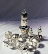 A George VI silver baluster shaped sugar sifter of panelled octagonal form on a spreading foot,