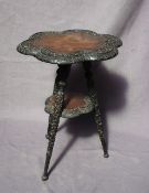 A 19th century walnut tripod table, the six sided shaped top carved with shamrocks and leaves,