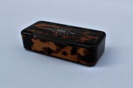 A large 19th century tortoise shell and horn snuff box of rectangular form,