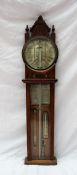 A carved oak case "Improved Torricelli Barometer" with a 9.