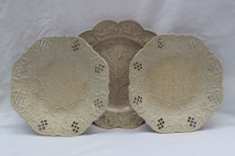A pair of 18th century salt glazed plates with moulded and pierced decoration,