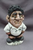 A John Hughes pottery Grogg of a Fijian rugby player in a white jersey with a number 11 on its