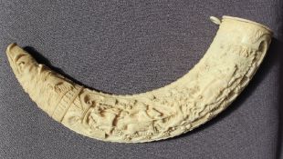 A 19th century carved ivory boar tusk powder flask, ornately intaglio carved ivory wild boar tusk,