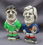 A John Hughes pottery Grogg of a French Rugby player with a rugby ball under his arm,