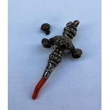 A late Victorian silver babies rattle, with coral teether, whistle and bells,