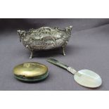 A continental white metal bowl, of oval form with winged cherub handles,