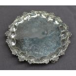 A Victorian silver waiter, with a scrolling edge,