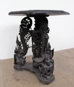A 19th century Burmese hardwood occasional table, the octagonal top carved with animals,