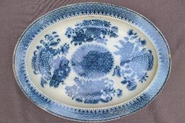 A Swansea pearlware "Trophies" pattern meat plate of oval form,