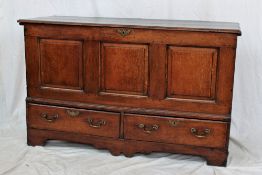 An 18th century oak coffer,