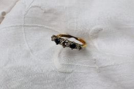 A sapphire and diamond line ring,